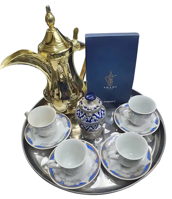 Brass dallah, Shahi Tea box and four cups on a silver serving tray